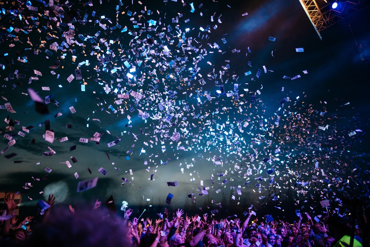 Confetti falling over a crowd at a corporate celebration